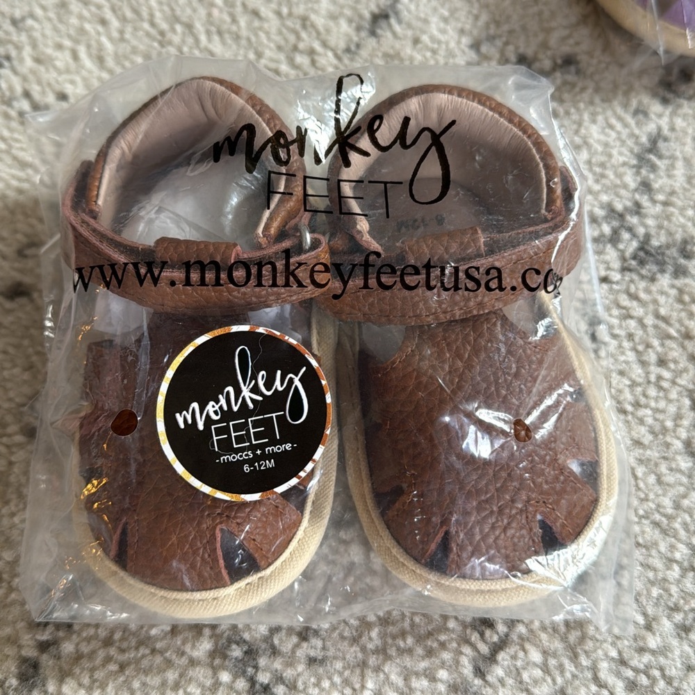 Monkey feet shoes/sandals. Brand new in package. Brown. Size 6-12mth
